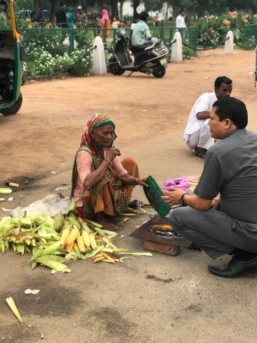 People all along the Rajpath selling corn.